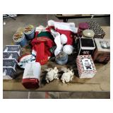 Christmas items including stockings, hats, tins,