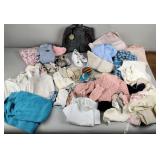 Vintage baby clothes including baby shoes