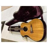 Gibson acoustic guitar in case, case has damage,