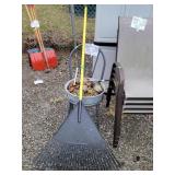 chair, galvanized pan, solar lights, rake