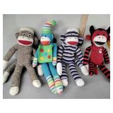 Sock monkeys, quantity four, devil sock monkey