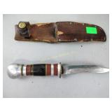 Knife and leather sheath- has tear
