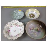 Five nature-themed ceramic bowls