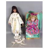 (2) porcelain dolls, on Native American