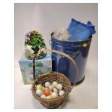 Tin, linens, golf balls, broken basket, water