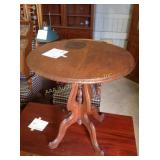 Vintage hardwood side table 27x 25" round, has