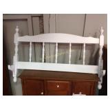 Painted footboard fashioned into rack