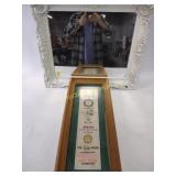 Framed mirror measuring approximately 25 inches