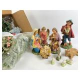 Christmas greenery and resin nativity figures
