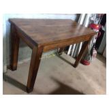 Wooden table with metal feet. 32"h x 48"w x 24"d