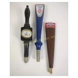 Beer taps including Budweiser, natural light, and