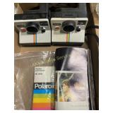 Polaroid one step cameras, quantity two, includes