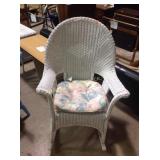 Wicker rocker. Minor paint wear and cushion