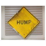 Road sign, hump, well worn