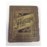 Antique photo album with greeting card and cut