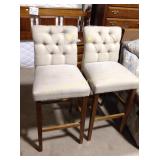 Upholstered barstools, some stains