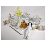 Vaseline glass basket, antique porcelain doll,