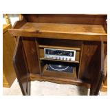 Magnavox stereo and turntable in dry sink cabinet