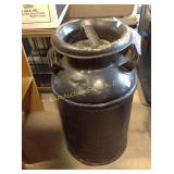 Painted milk can, some dents