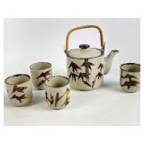 Vintage ceramic teapot and cups one cup has a