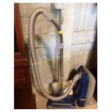 Kenmore vacuum and extra replacement bags, powers