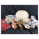 Dish cloths, small ceramic pitchers, plates