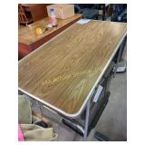 Folding table, 48.5in long, 24in wide, 28in tall