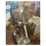 Revere film projector, small metal film chest