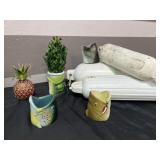 Boat fenders, fish beer koozies, decor plant and