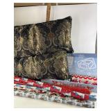 Large decor pillows, wrapping paper, bows
