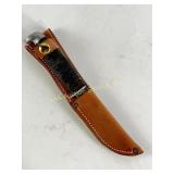 Black handled knife w/ leather sheath, 3.5" blade