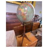 Globe on wooden stand, some wear, 34in tall