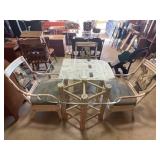 Glass top table and three chairs, very worn,