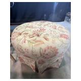 Round ottoman with floral design, wooden frame
