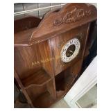 Wooden wall shelf with clock, slightly worn, 35in