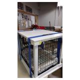Pet cage with white  wooden top and frame,