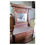 Wooden dresser with marble top, has tilting