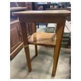 Small wooden side table (worn, has marks and