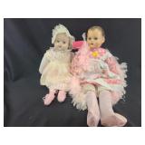 Two large plastic dolls, eyes move, one broken