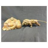 Brass lion and wooden buddha