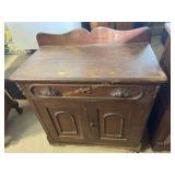 Wooden commode, has ornate wooden pulls, missing
