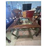 Metal table (missing glass top), wicker footrest