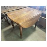 Wooden dining drop leaf table, six table leaf
