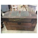 Wooden camel back trunk, missing leather handles