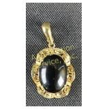 14k gold pendant w/black stone cabochon
