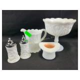 An assortment of milk glass pieces, salt and