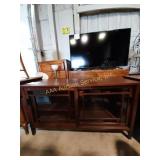 Wooden tv stand with sliding glass doors