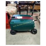 Rubbermaid rolling cooler with handle.