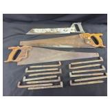 Vintage telephone pole climbing spikes, hand saws
