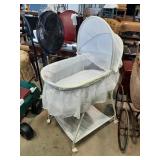 Bassinet on casters, 17"x32"x30" good condition